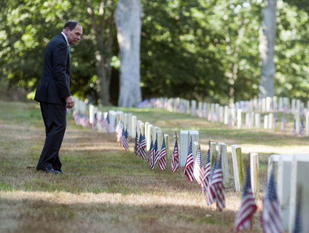 Veterans Affairs Secretary Robert A. McDonald, one of the federal officials president-elect Donald Trump says he will replace, looks around the Togus National Cemetery during 150th anniversary events in September at VA Maine Healthcare Systems-Togus.