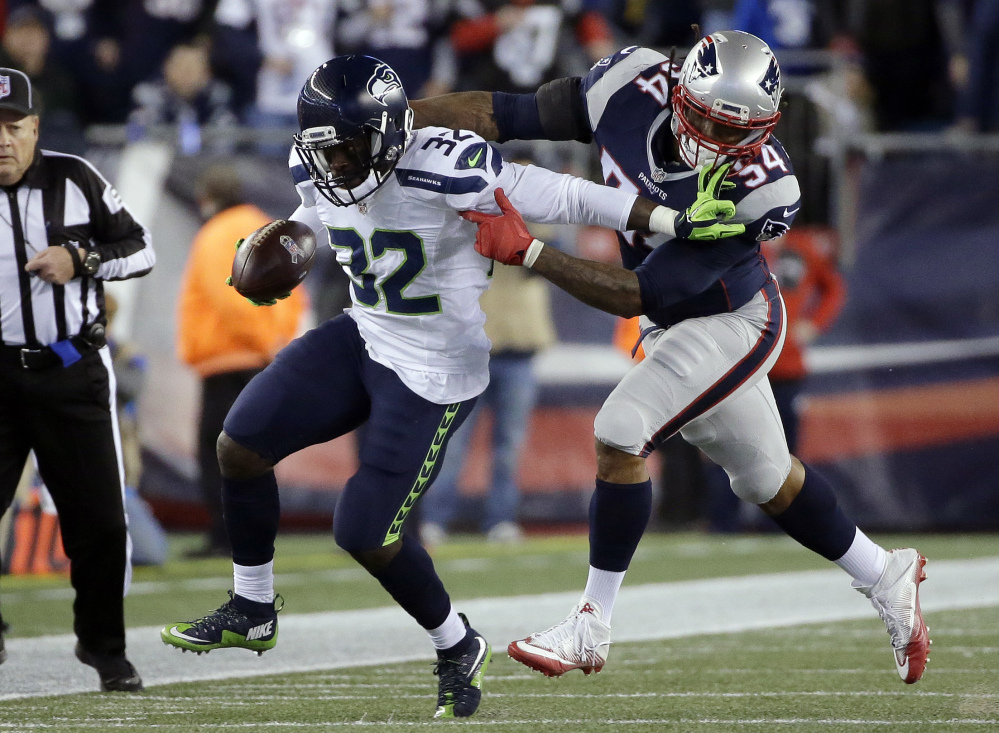 New England Patriots linebacker Dont'a Hightower (54) chases down Seattle Seahawks running back Christine Michael during the first half Sunday in Foxborough, Massachusetts.