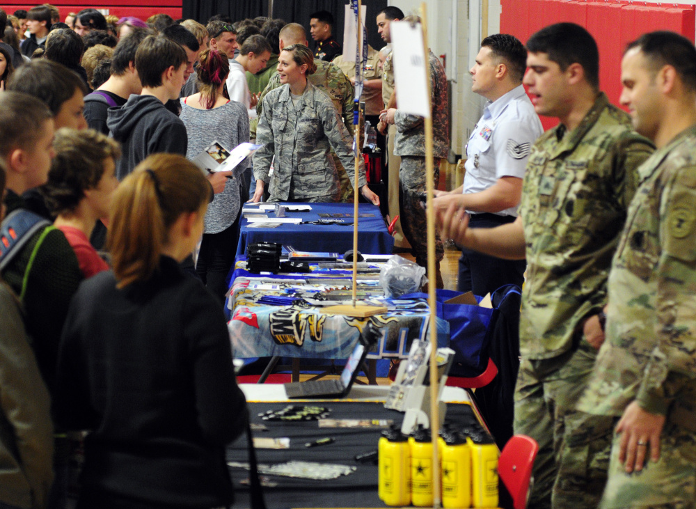 Recruiters from various service branches chat with students Thursday during a college and career fair held in the Cony High School gymnasium.