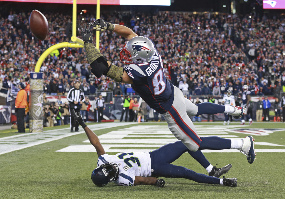 New England Patriots tight end Rob Gronkowski can't catch a pass in the end zone over Seattle safety Kam Chancellor in the final moments of a game last Sunday in Foxborough, Massachusetts.