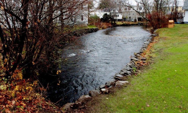 The Outlet Stream that flows out of China Lake in Vassalboro is full on Wednesday. Nearby resident Al Roy said the water is at a high level because the Kennebec Water District is flushing the lake of phosphorus by lowering dam gates.