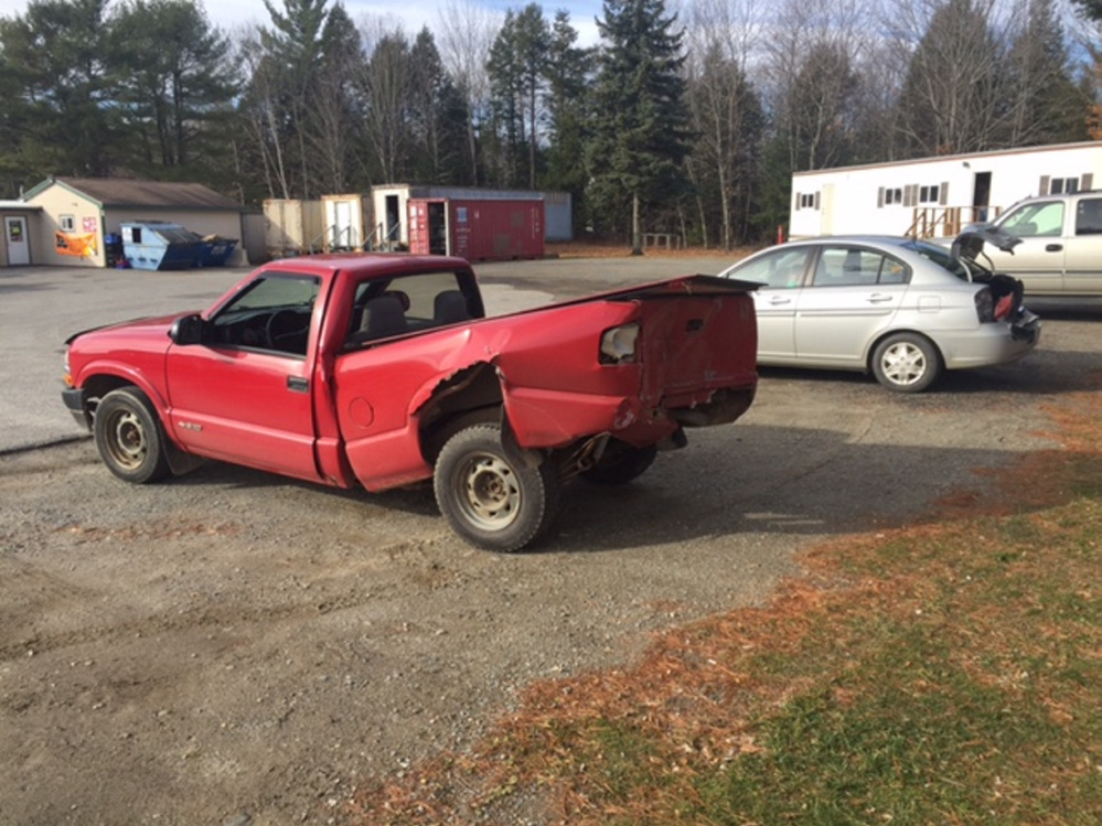 In a photo provided by the Waldo County Sheriff's Office, a Chevrolet S-10 is seen damaged Tuesday after it was struck from behind by a Jeep Wrangler, causing a crash with a Hyundai Accent as well, in front of the Troy General Store in Troy.