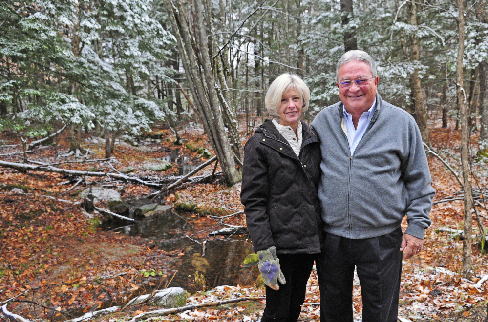 Lisa and John Rosmarin pose for a portrait on Friday on land in Readfield that they donated to the Kennebec Land Trust.