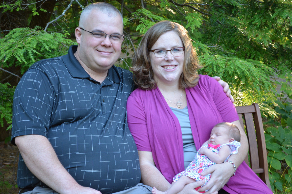 Mathew Guilfoyle, 38, a Winthrop dispatcher who died on Thanksgiving Day, is shown in this photo with his wife, Nicole, and daughter Eleanor.