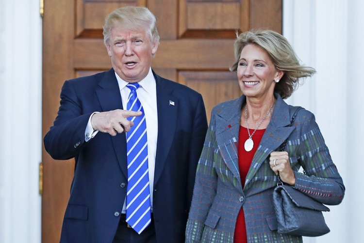 President-elect Donald Trump and Betsy DeVos pose for photographs at Trump National Golf Club Bedminster clubhouse in Bedminster, N.J., Nov. 19, 2016. <em>Associated Press/Carolyn Kaster</em>
