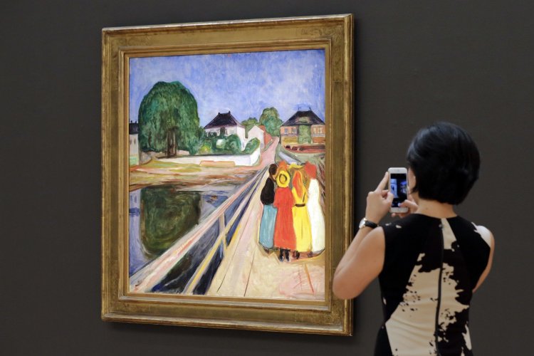 A work by Norwegian artist Edvard Munch, "Girls on the Bridge," is displayed at Sotheby's, in New York. The painting sold at auction for more than $54 million.