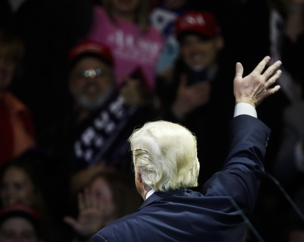 President-elect Donald Trump waves to supporters after speaking during the first stop of his post-election tour on Thursday in Cincinnati. A key challenge for the Trump administration is to extend the benefits of job growth to include many of those who feel left out, many of them frustrated former manufacturing workers.