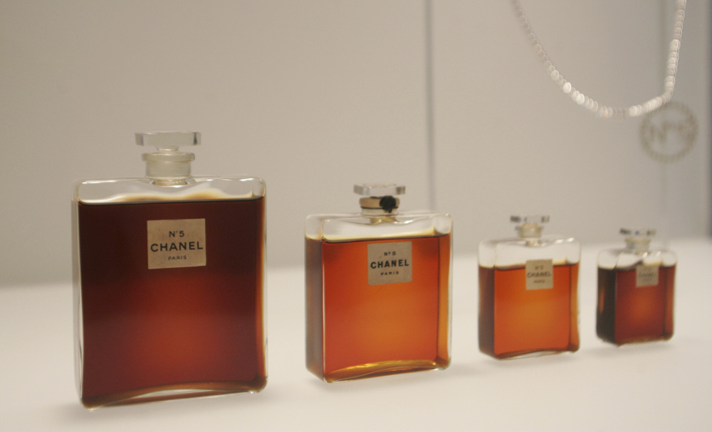 In this May 2, 2005 file photo, bottles of Chanel No. 5 perfume are displayed at the Metropolitan Museum of Art's Costume Institute exhibit in New York. Chanel is making a stink over a possible high-speed train line through jasmine fields in Provence, warning it could threaten production of its Chanel No. 5 perfume.