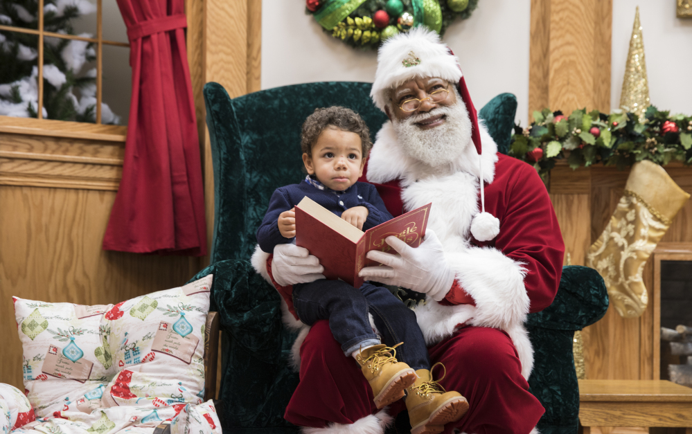 A Santa of color may be coming to town: Larry Jefferson relishes his role at the Bloomington, Minn., Mall of America. The mall hired him for a four-day stint and found him to be a hit with youngsters like Kingston Strong.