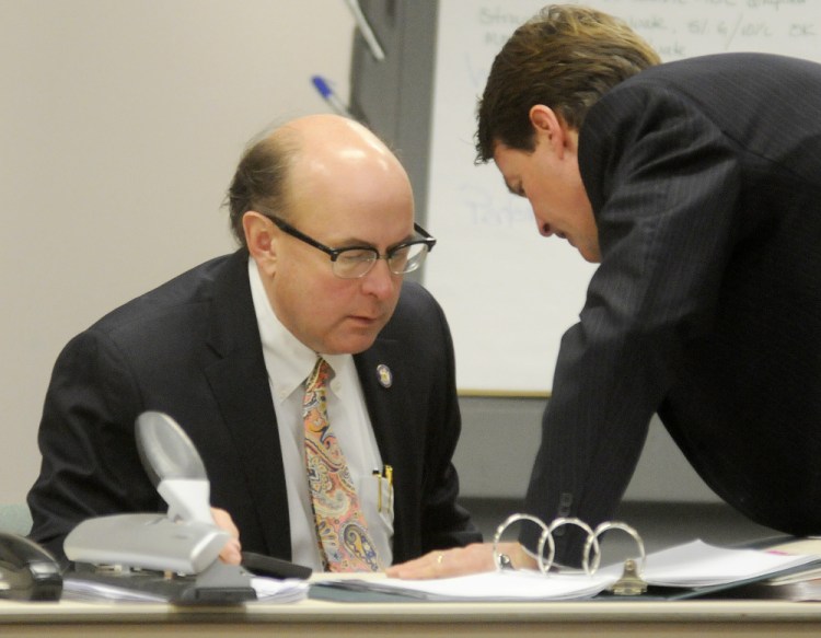 Newell Augur of the No on 1 Campaign, right, confers Monday with Secretary of State Matt Dunlap during a recount in Augusta on the referendum question to legalize recreational marijuana consumption in Maine.
