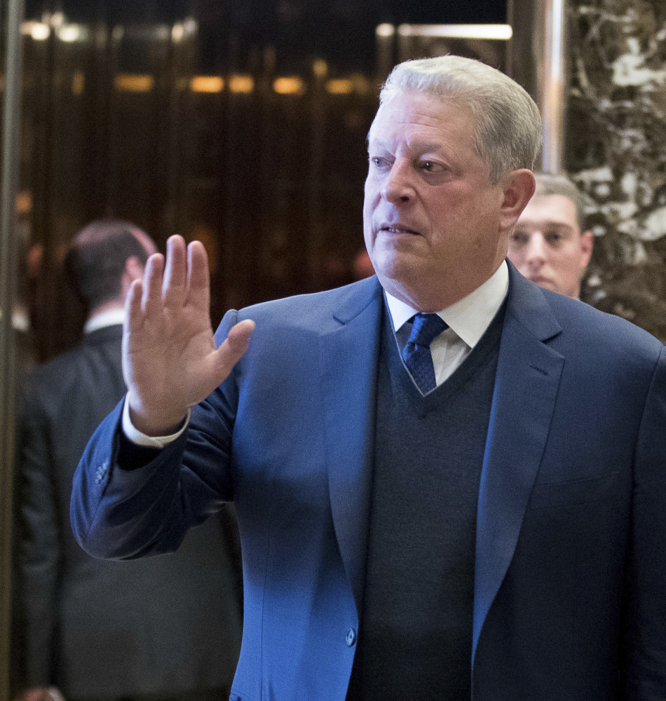 Former Vice President Al Gore waves to the media after meeting with Ivanka Trump and President-elect Donald Trump on Monday. Trump has called climate change a “hoax,” but Gore said he and Trump had a "sincere search for areas of common ground" in their meeting.