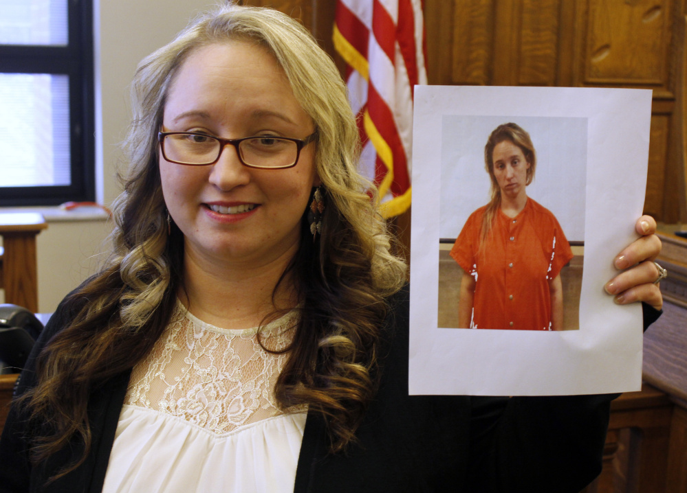 Faith Spriggs shows her jail booking photo from three years ago, in Albion, Ind. Today she's a graduate of the Noble County Drug Court and hasn't used in 32 months.