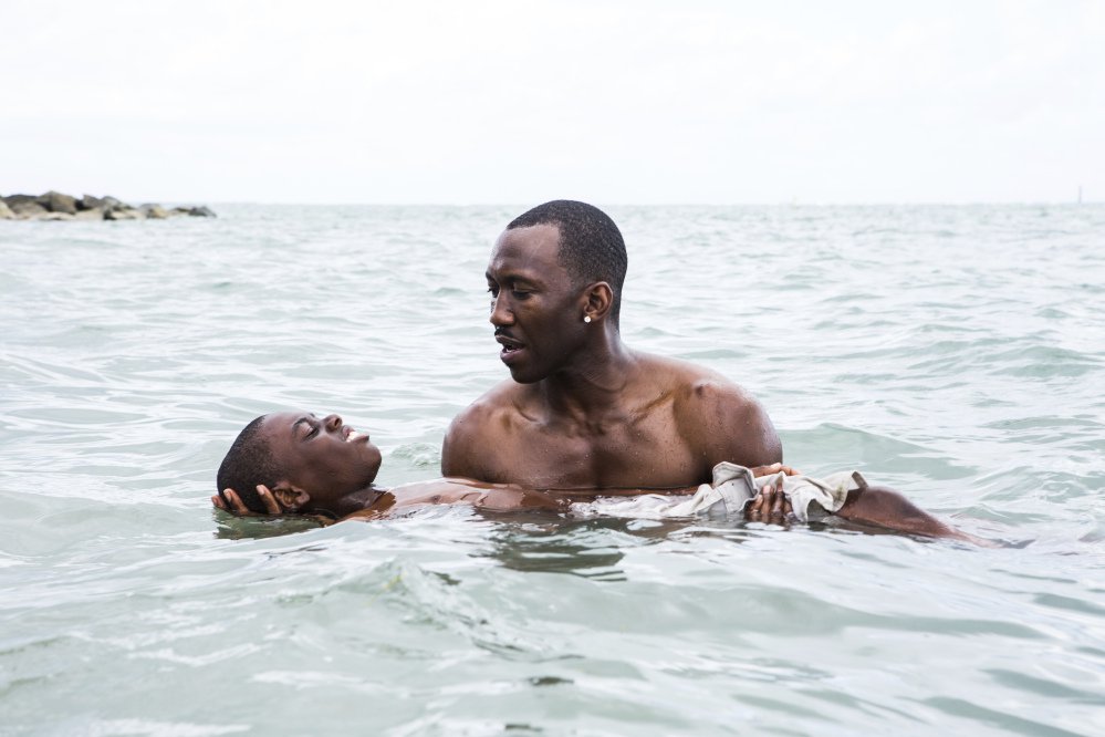 Alex Hibbert, foreground, and Mahershala Ali in a scene from the film, "Moonlight." The 74th Golden Globe Awards ceremony will be broadcast on Jan. 8, on NBC.