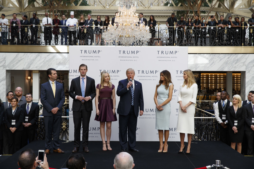 Associated Press/Evan Vucci
President-elect Donald Trump is shown with from left, Donald Trump Jr., Eric Trump, Melania Trump, Tiffany Trump and Ivanka Trump at an event when he was still a candidate. He has postponed an announcement until January on how he will avoid a conflict of interest with his worldwide business empire once he takes office.