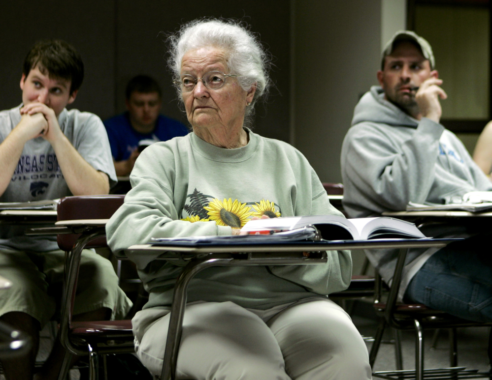 Nola Ochs listens to a lecture at Fort Hays State University in Hays, Kan., in 2007. Ochs moved from her farm to finish her degree there and took classes until she was 100.