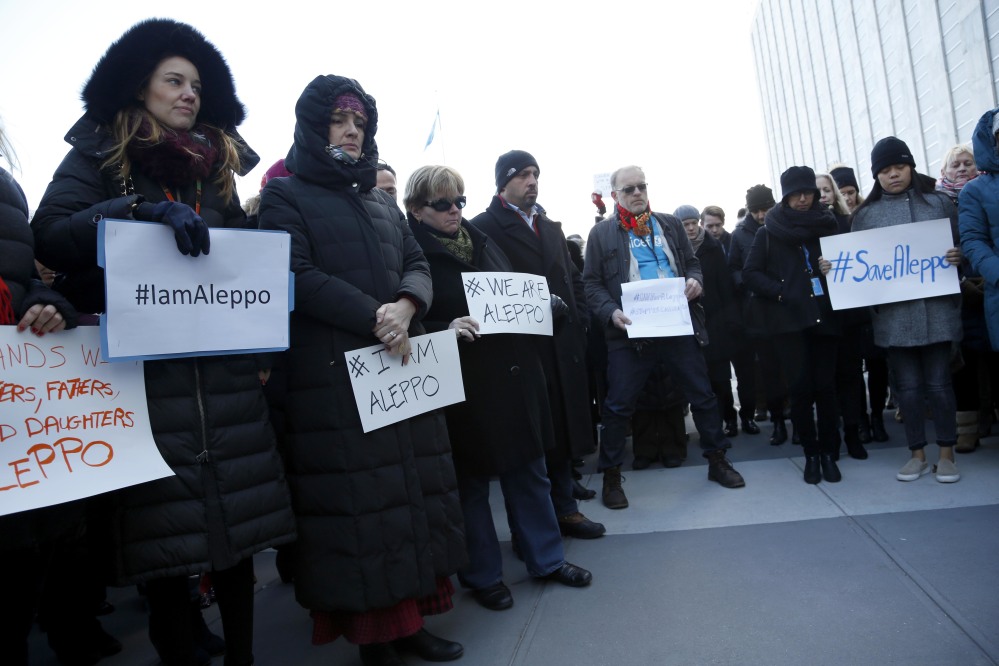 United Nations staff and other supporters assemble on U.N. headquarters grounds to show their solidarity with the people of Aleppo, Syria, on Thursday.