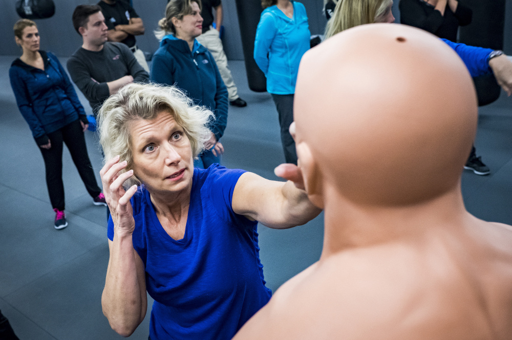 Flight attendant Gina Hernlem, 55, takes part in a self-defense seminar Dec. 2 near Dulles International Airport. More than 11,000 crew members nationwide have taken the Transportation Security Administration's voluntary four-hour course.