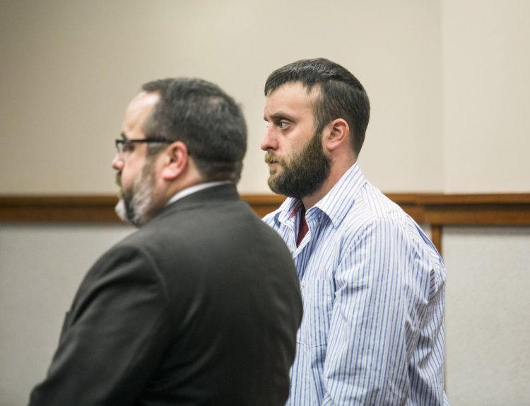 Jeffrey E. Smith Jr. stands with his attorney, Robert LeBrasseur, during a court appearance Wednesday. Smith is charged with leaving the scene of an accident that resulted in death, a felony.