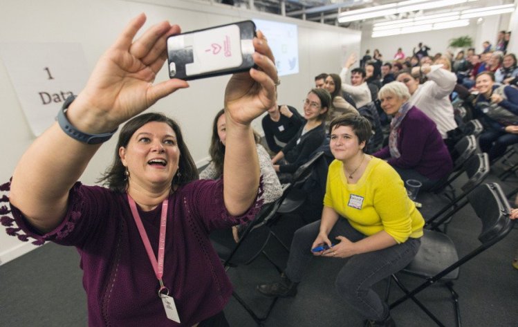 Nicole Clegg of Planned Parenthood takes a group selfie with supporters during an "action forum" Wednesday. "We are facing something we have never seen before," Clegg told them.