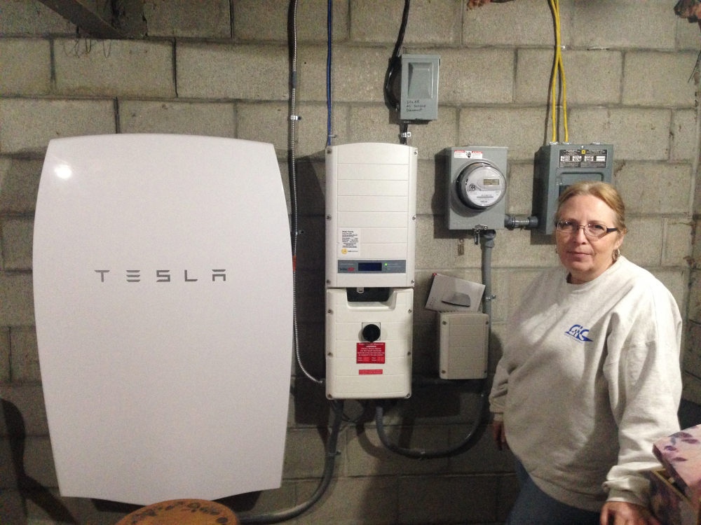 Associated Press/Dave Gram
Rhonda "Honey" Phillips  of Middletown Springs is one of the growing number of Green Mountain Power customers using the Tesla battery to store solar energy when her panels aren't collecting it.