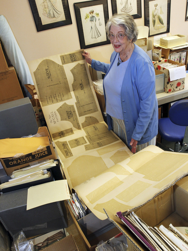 Joy Spanabel Emery, curator of the University of Rhode Island's commercial pattern archive, displays one of 50,000 paper sewing patterns in the collection that she oversees.