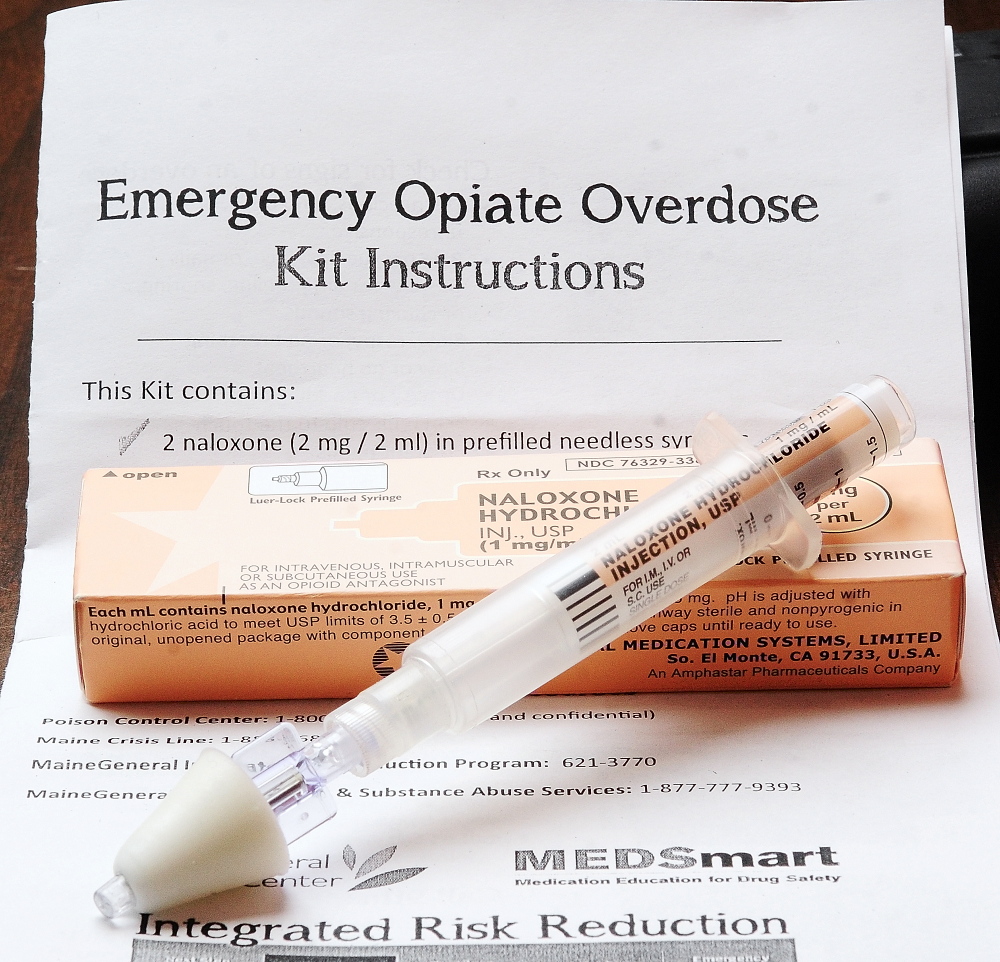 An emergency opiate overdose kit is shown in 2014 at the MaineGeneral Harm Reduction program office in Augusta. The cone-shaped adapter is placed in the victim's nose to turn the liquid naloxone into a spray that helps the person start breathing again.
