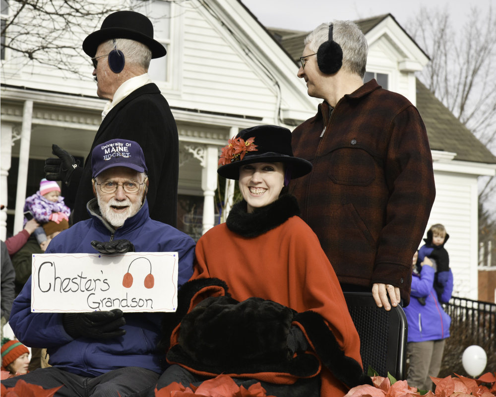Relatives of Chester Greenwood, a Farmington native who invented earmuffs, led the parade Saturday in celebration of both his invention and the holidays. Shown here, in front from left, are Chester Greenwood's grandson George Greenwood and his great-great-granddaughter Elizabeth Greenwood Thomas. In back, from left, are Clyde Ross and Clinton Greenwood, Chester Greenwood's grandson. Thomas is dressed up as her great-great-grandmother, Isabel Greenwood; and Ross is dressed as Chester Greenwood.