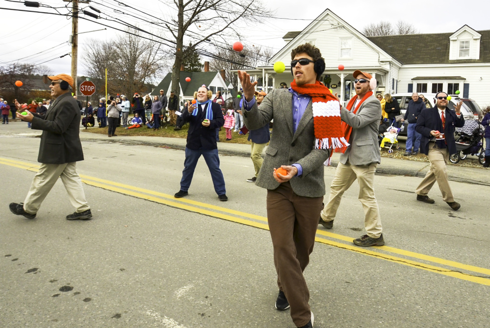 Jugglers don earmuffs Saturday in honor of Chester Greenwood, a Farmington native who invented earmuffs. The parade dedicated to Greenwood takes place annually on the first Saturday of December in downtown Farmington.