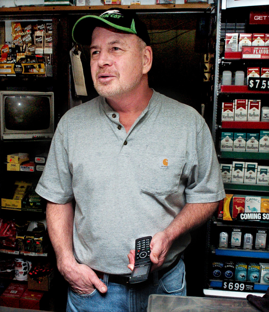 The newly erected cellphone tower off the Sugar Hill Road in Harmony allows C&R General Store owner Ron Robinson the use of his cellphone from inside his store in Harmony on Thursday.