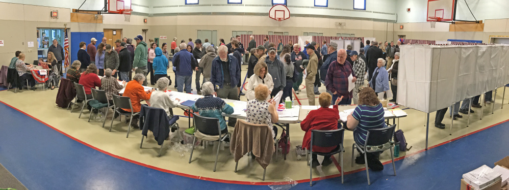 Voters wait in line to cast ballots at the Boys and Girls Club of Greater Gardiner in this Nov. 8 file photo. A Gardiner city council candidate says the club may have jeopardized its non-profit status by publicly backing another candidate for council.