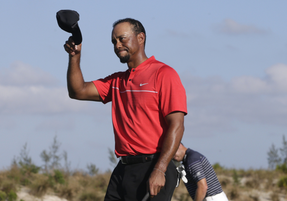 Tiger Woods walks off the 18th green during the final round at the Hero World Challenge on Sunday in Nassau, Bahamas.