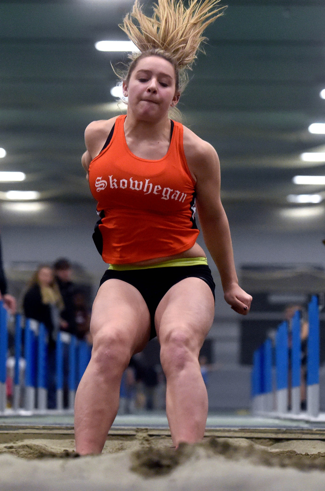 Skowhegan's Leah Savage competes in the long jump during a Kennebec Valley Athletic Conference indoor track and field meet last year at Colby College in Waterville.