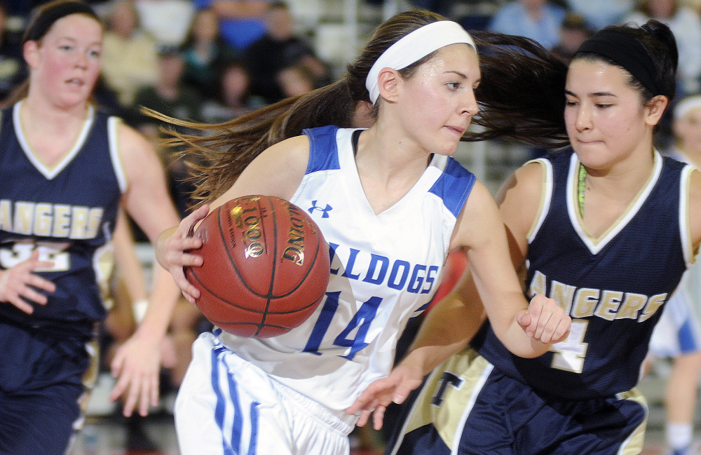 Madison's Sydney LeBlanc moves around Traip defender Kiara Perez during a Class C South quarterfinal last season at the Augusta Civic Center. The Bulldogs graduated a lot of key players but return plenty of talent to make another postseason run this season.