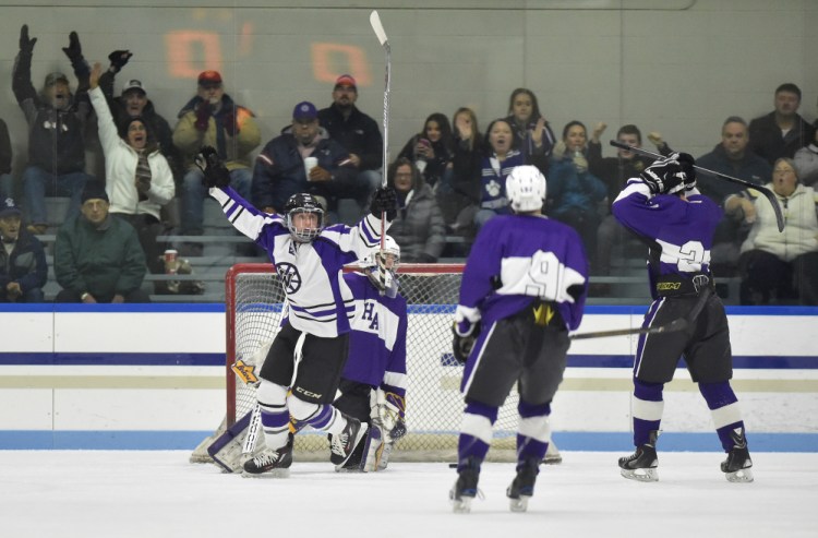 Waterville Senior High School's Justin Wentworth celebrates a goal against Hampden Academy in the first period at Colby College on Saturday night.