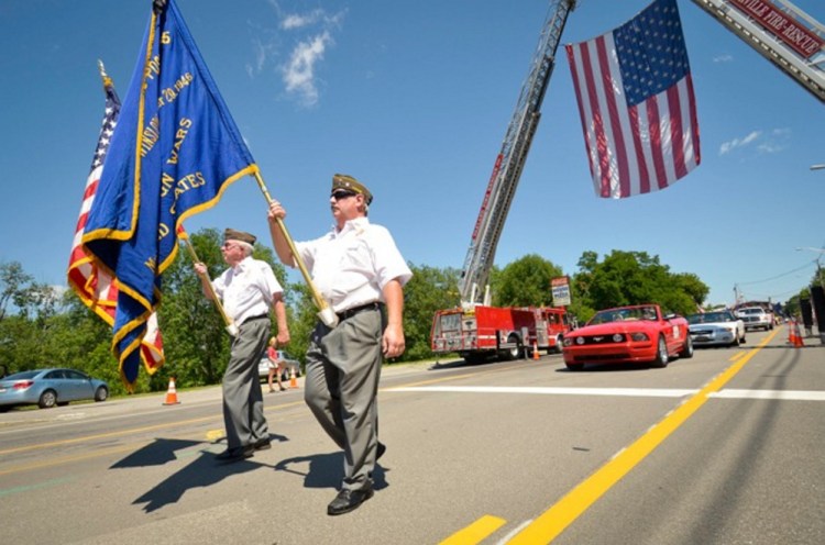A Veterans of Foreign Wars post marches in the Winslow Family 4th of July Celebration parade on July 4 this year.