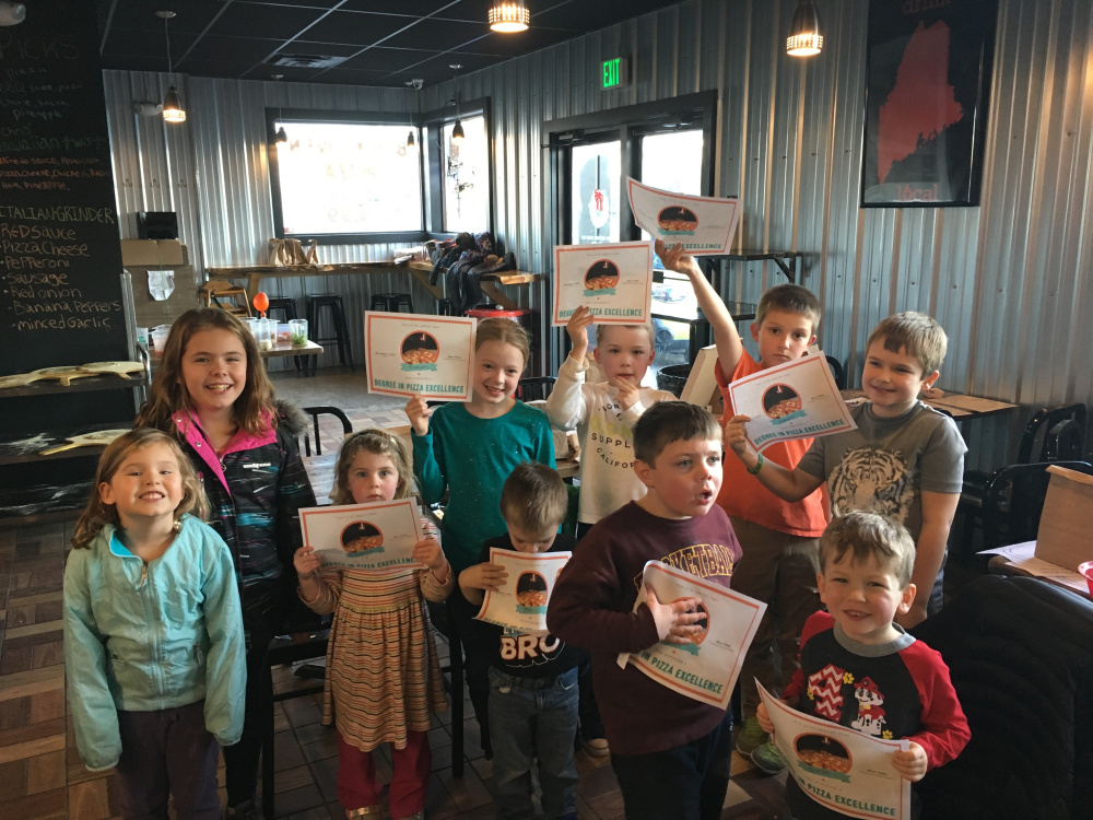 Twelve kids from the Augusta area, ages 3 to 14, learned the art of pizza making through hands-on experience called Pizza School. Front, from left, are Charlotte Buccellato, Sabrina Foth, Jonah Baker, Jackson Foth and Hunter Caron. Back, from left, are Emma Buccellato, Madysen Baker, Josiah Baker, Mason Hutchings and Braeden Temple. The Pizza Degree, an Augusta Restaurant that just celebrated its first year of business, hosted the Nov. 4 program.