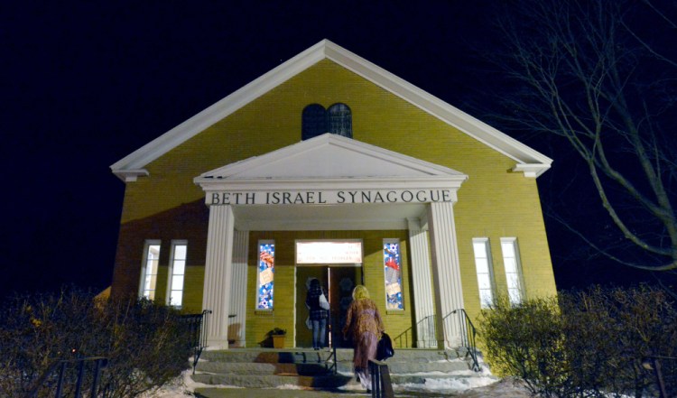 People gather at an interfaith service of healing Friday evening at Beth Israel Congregation in Waterville in response to swastika having been painted on a rock at the city-owned Quarry Road Recreation Area.