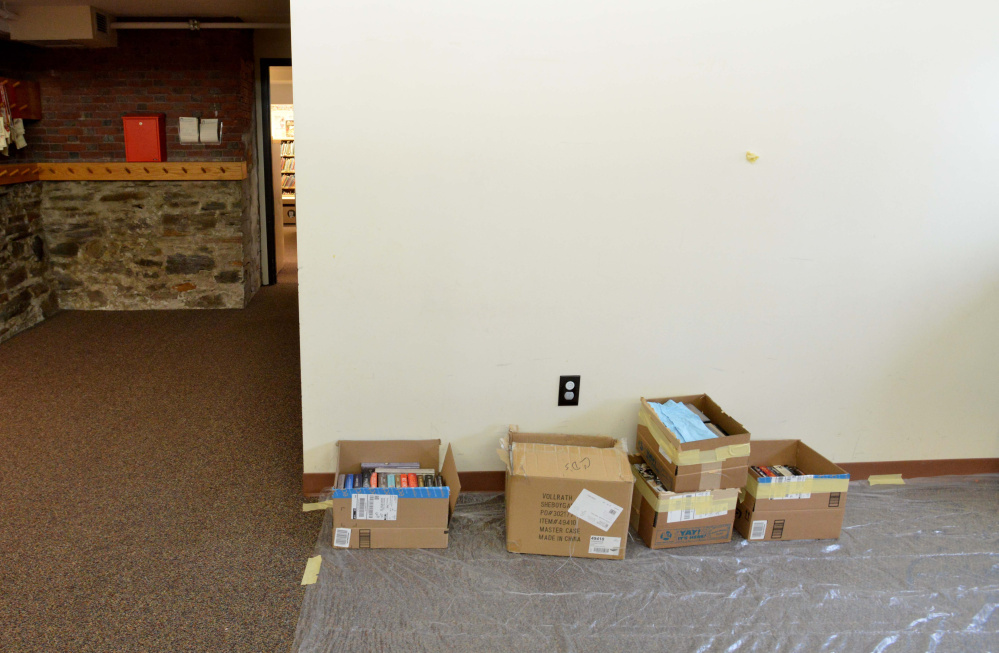 A drying area is set up Saturday at the Waterville Public Library to accommodate books and computers damaged by water from a broken pipe at the library.