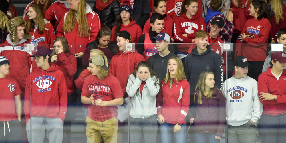 Messalonskee High School hockey fans react during the first period of a game against Winslow last Wednesday at Colby College in Waterville.