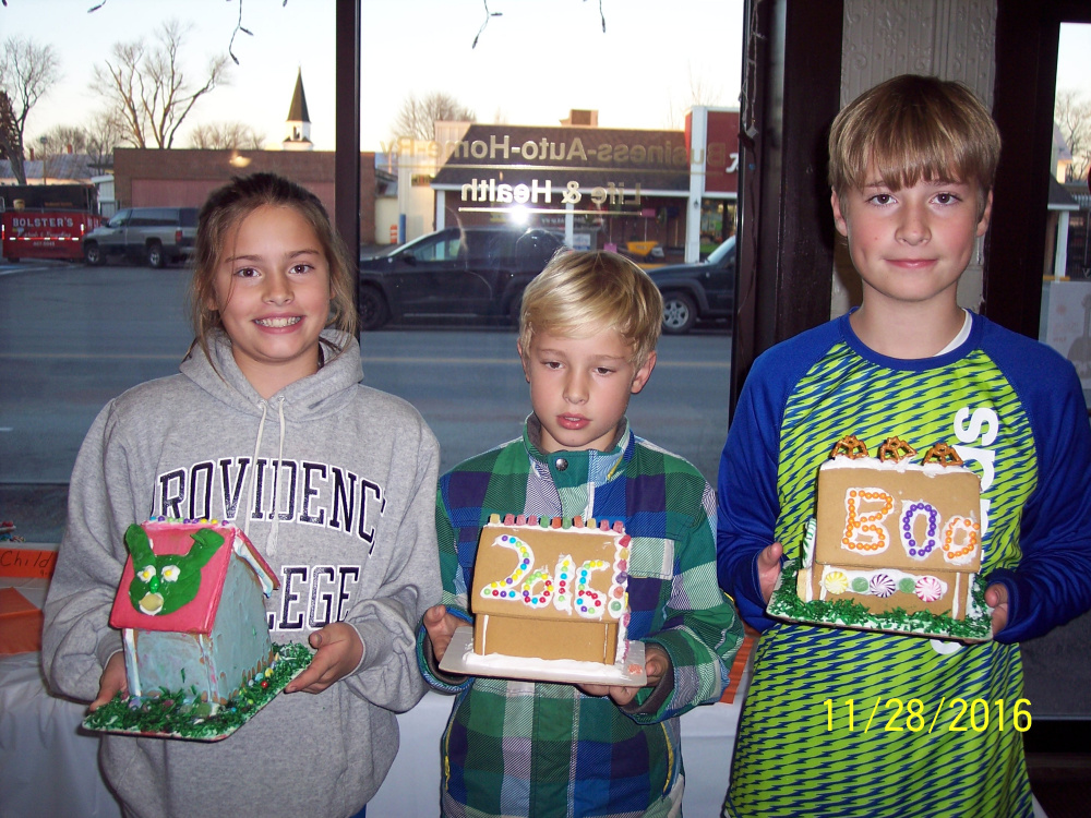 Elle, Finn and Ryan Donoghue with their gingerbread house entries.
