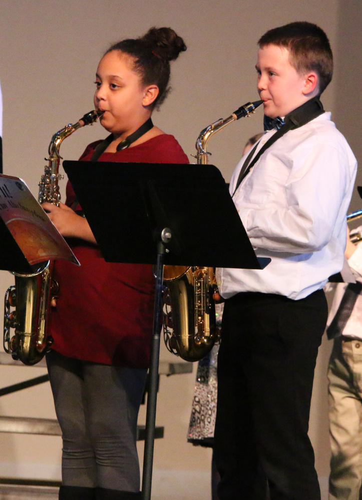 Madison Quimby, left, and Nash Corson perform in Benton Elementary's Holiday Concert on De. 15.
