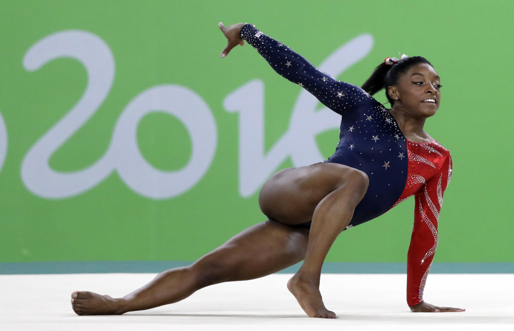 Simone Biles performs on the floor during the artistic gymnastics women's qualification at the 2016 Summer Olympics in August in Rio de Janeiro, Brazil. Biles was selected as the AP Female Athlete of the Year on Monday.