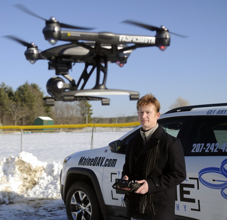 Photographer Thomas-john Veilleux operates a drone last week in Augusta while discussing the technological and regulatory hurdles he's had to overcome with the expansion of his photography business.