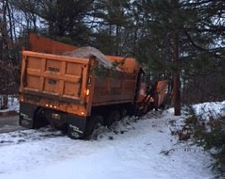 A Waterville Public Works truck went off the road on Country Way Monday night during icy conditions.