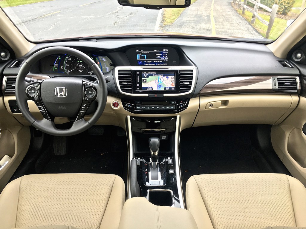 The interior on the premium Touring trim is more like Acura than Honda, with cream-colored leatherette seats and wood accents in the dash.