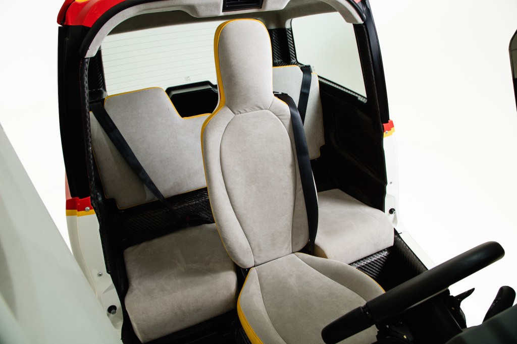 The driver's seat, like a Formula One race car's, is mounted in the center of the vehicle.