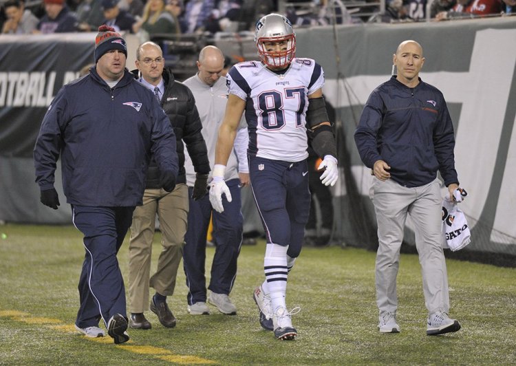 New England Patriots tight end Rob Gronkowski walks off the field after he was injured in the second quarter of Sunday's game against the New York Jets. <em>Associated Press/Bill Kostroun</em>