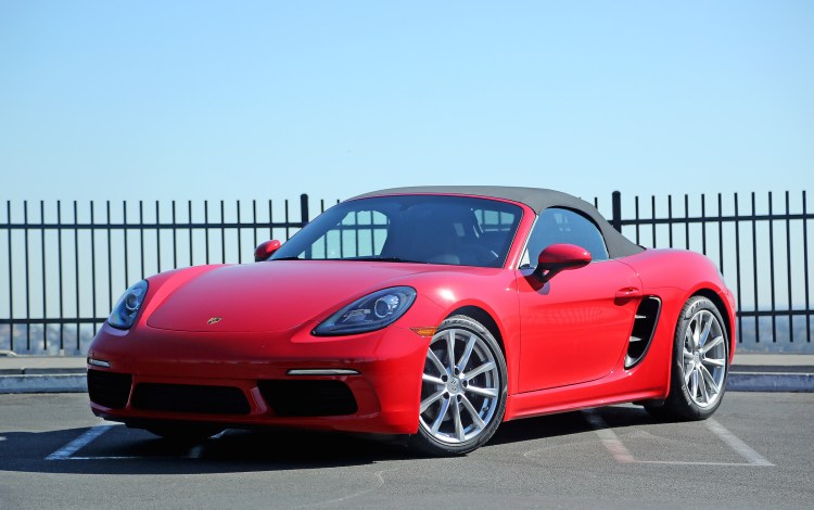 The 2017 Porsche 718 Boxster with the top up. The newest Boxster comes with a 2.0-liter, turbocharged boxer four cylinder engine that makes 300 horsepower. A six-speed manual transmission puts the power to the ground. 