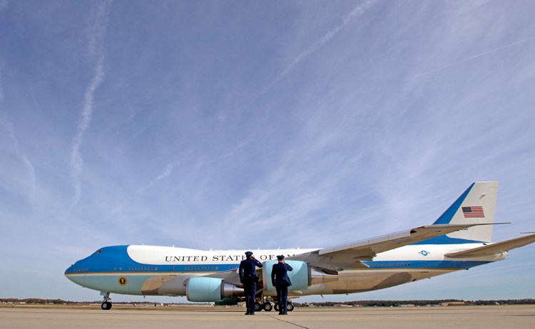 Military personnel salute as Air Force One, with President Barack Obama aboard, departs at Andrews Air Force Base, Md., on Nov. 6, 2016. President-elect Donald Trump wants the government's contract for a new Air Force One fleet to be canceled.  <em>Associated Press/Jose Luis Magana</em>