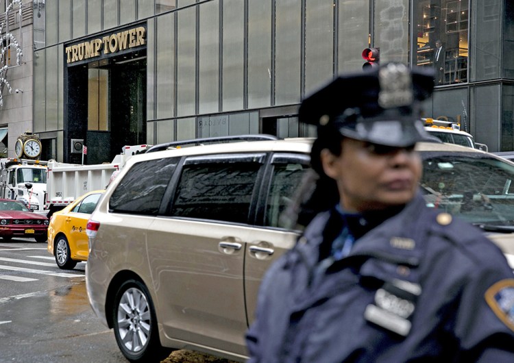 A New York Police Department officer watches over a closed pedestrian intersection across the street from Trump Tower in New York recently. <em>Bloomberg/Daniel Acker</em>